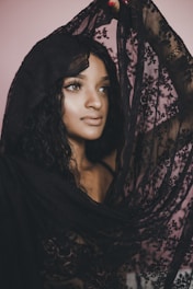 woman holding black scarf
