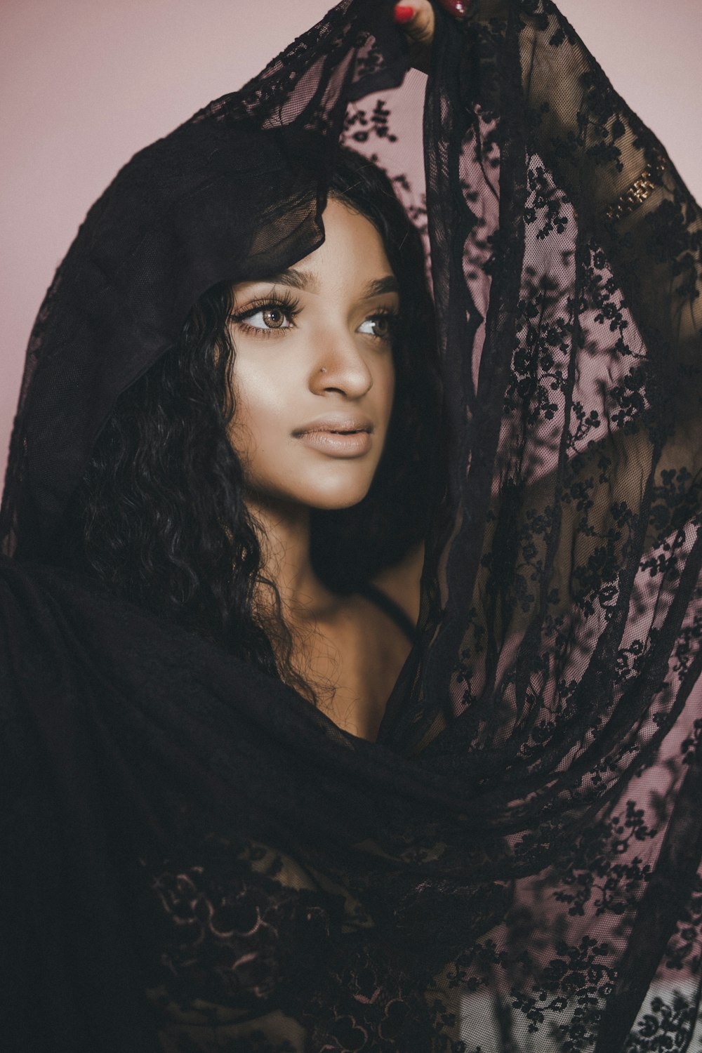 woman holding black scarf