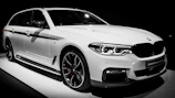 BMW 750li showcased with brushed silver accents and subtle electric blue highlights.