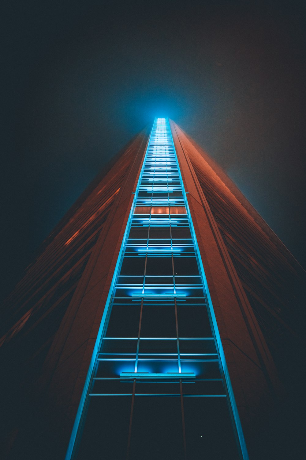 low angle photography of lighted high rise building