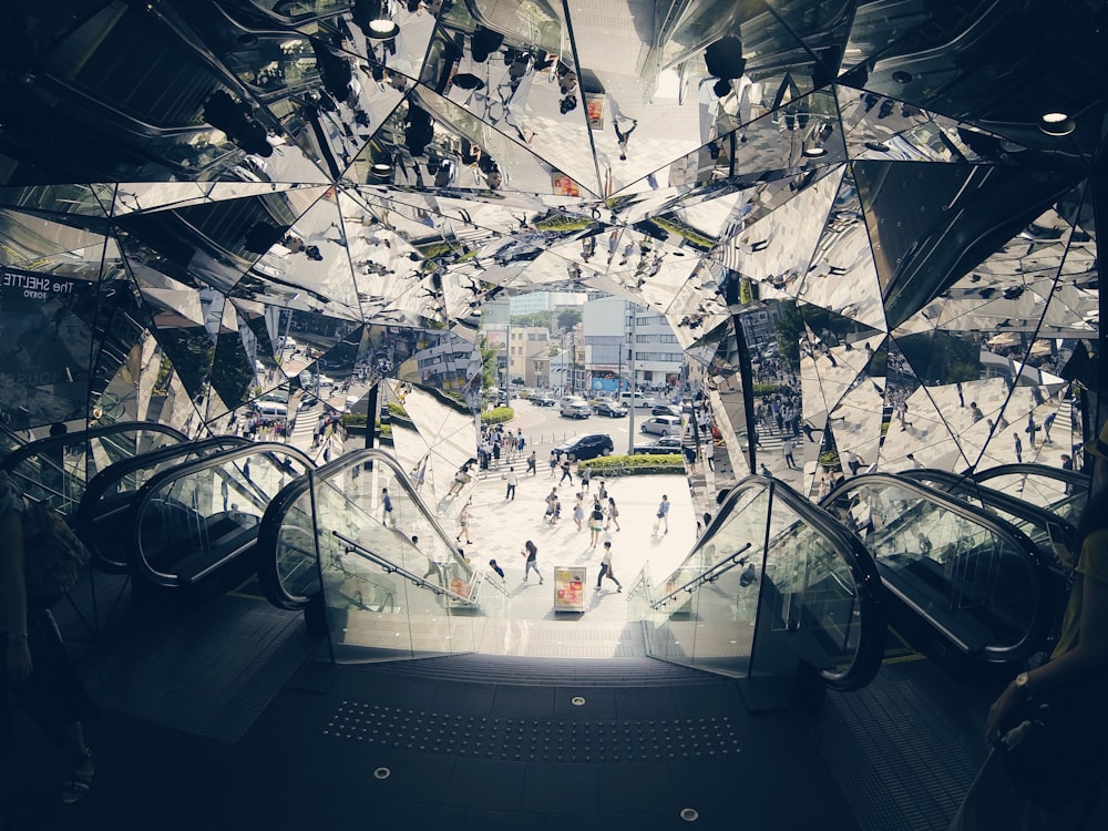 people walking near escalator