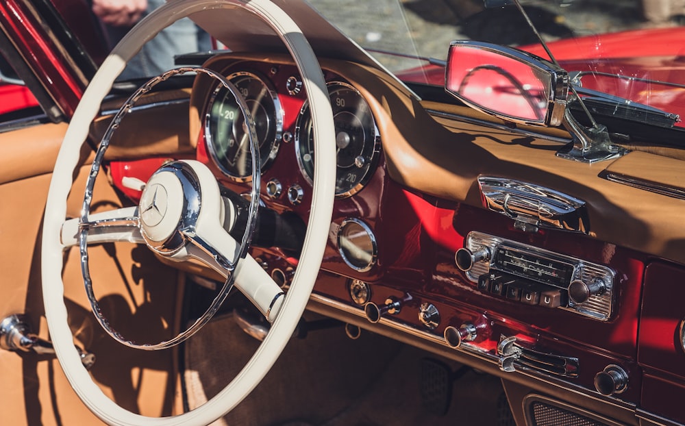 closeup photography of white Mercedes-Benz vehicle steering wheel