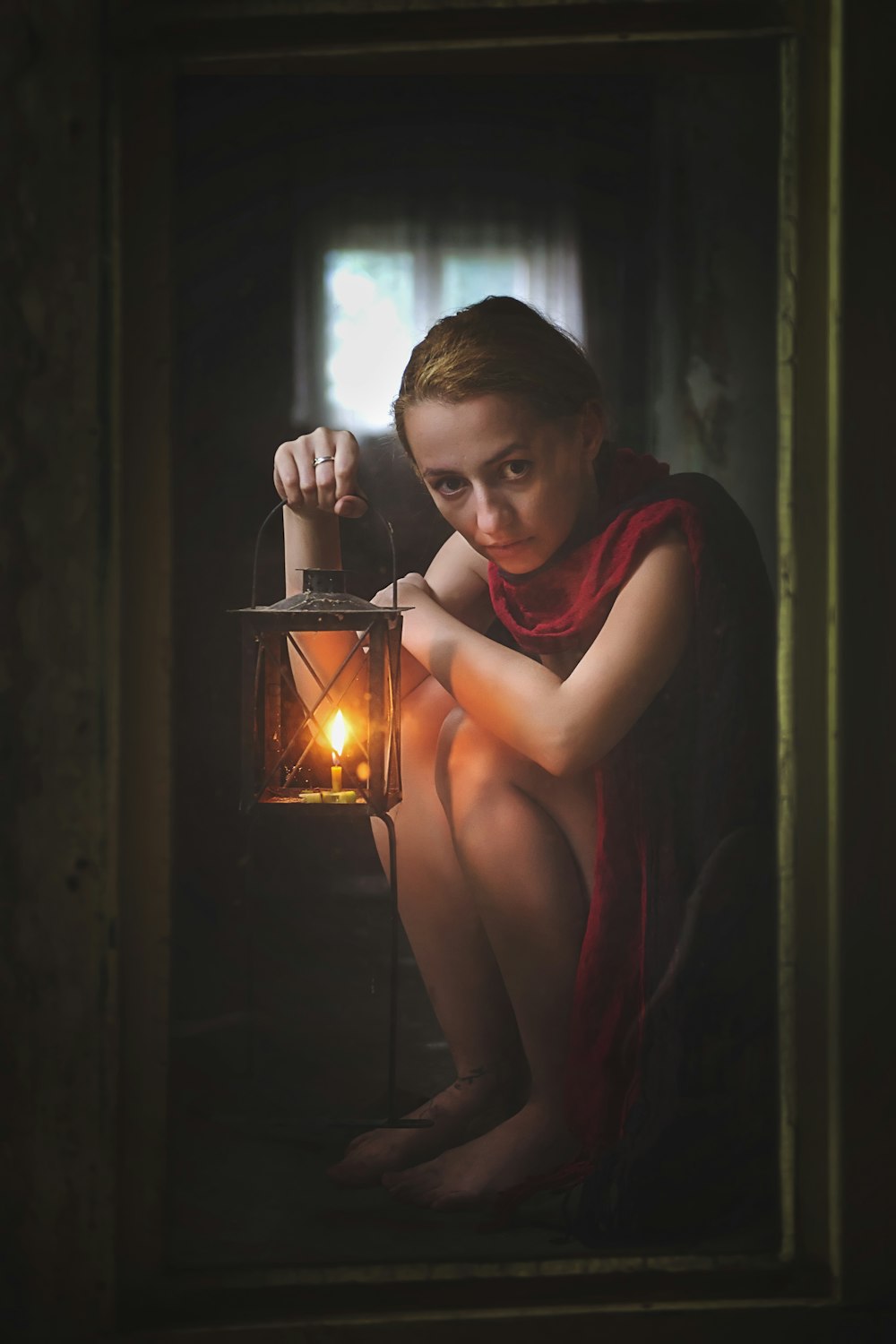 woman holding candle lantern framed photo