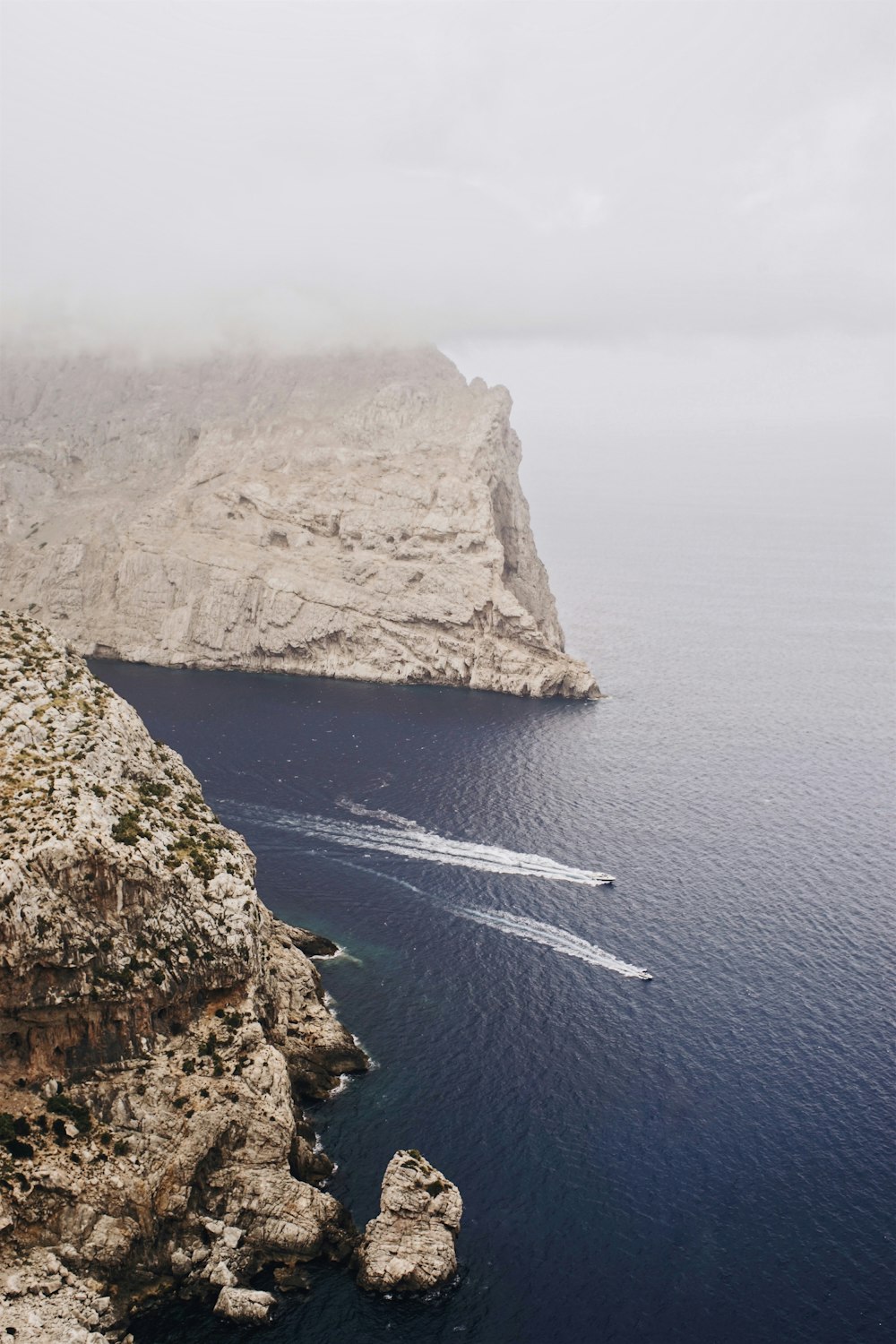 gray mountain on body of water