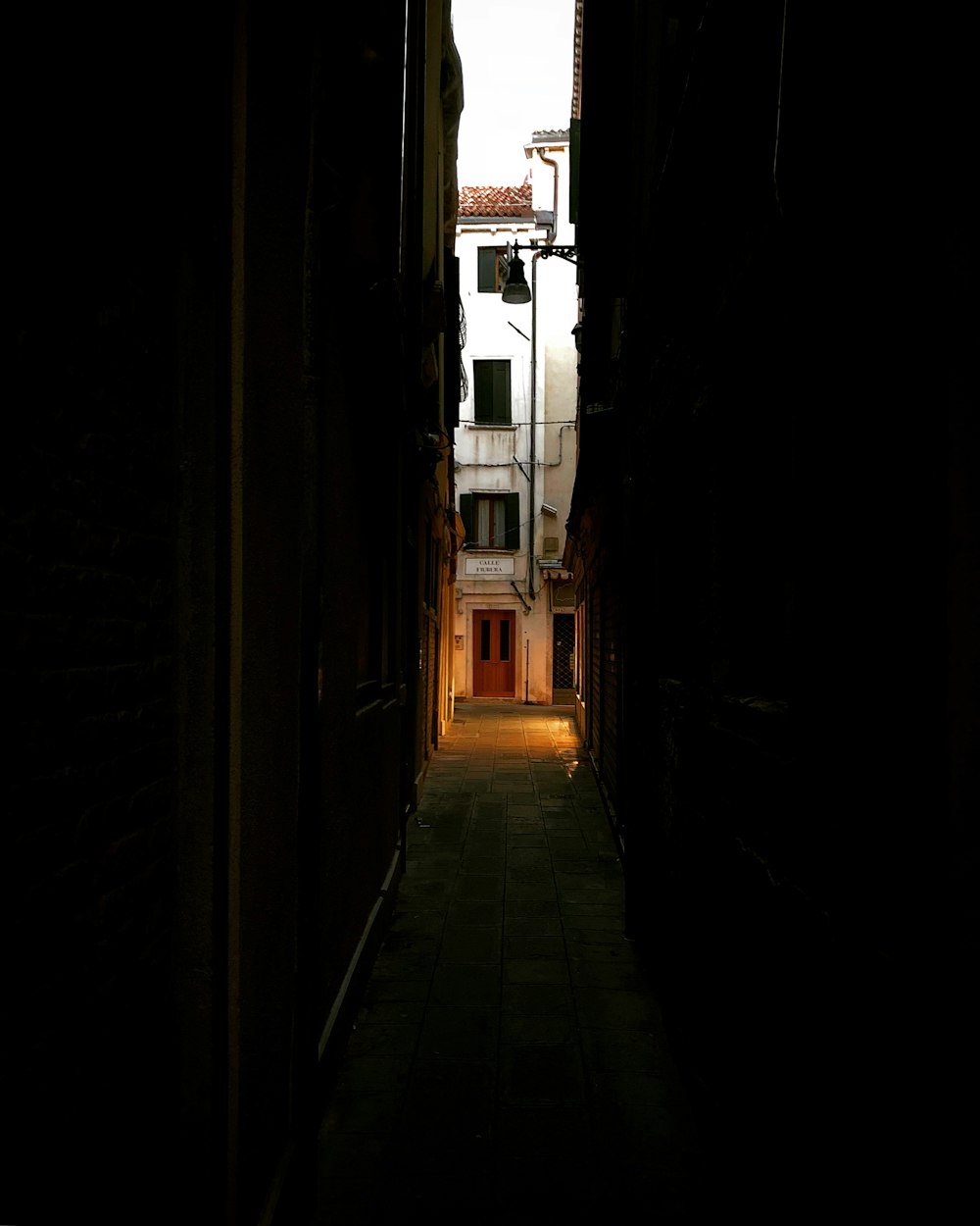 photo of gray concrete alley