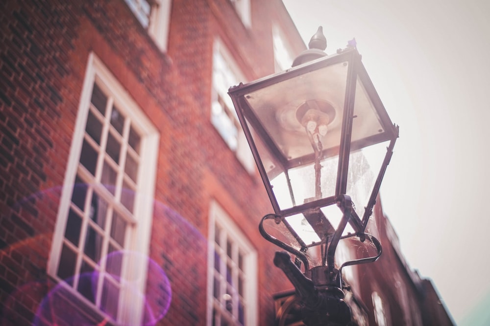 selective focus photography of turned off post lamp