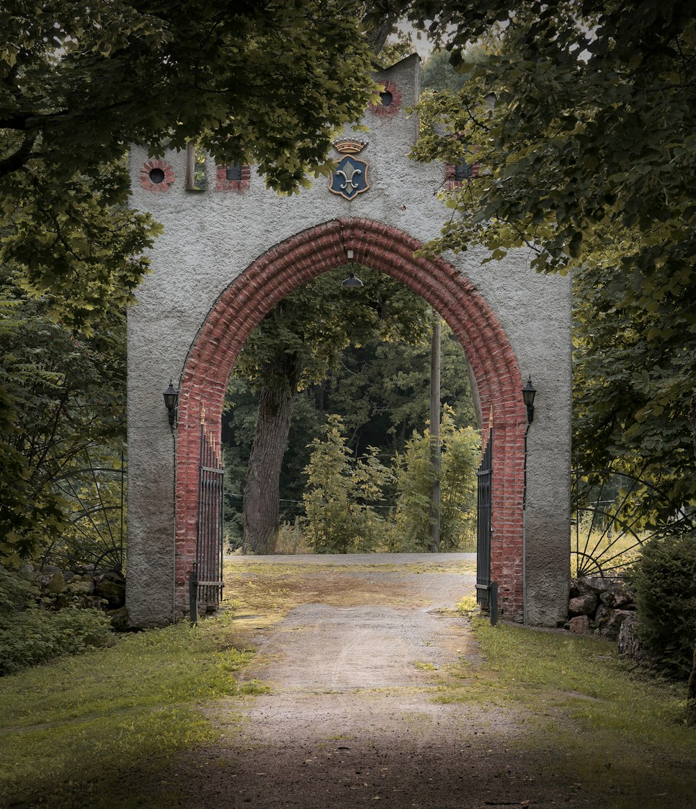 brown brick arch with green grass field