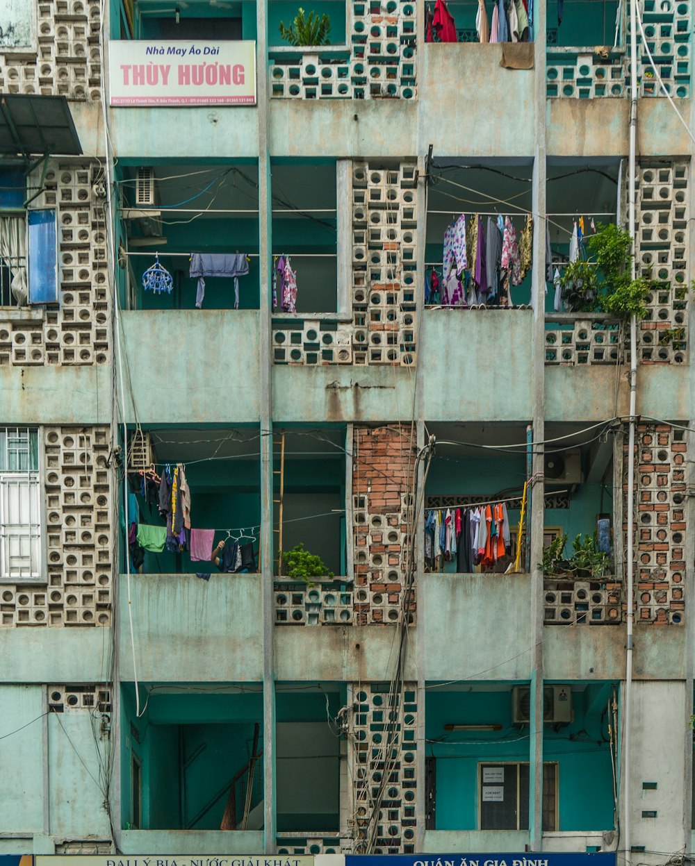 clothes hanged from apartment-style building