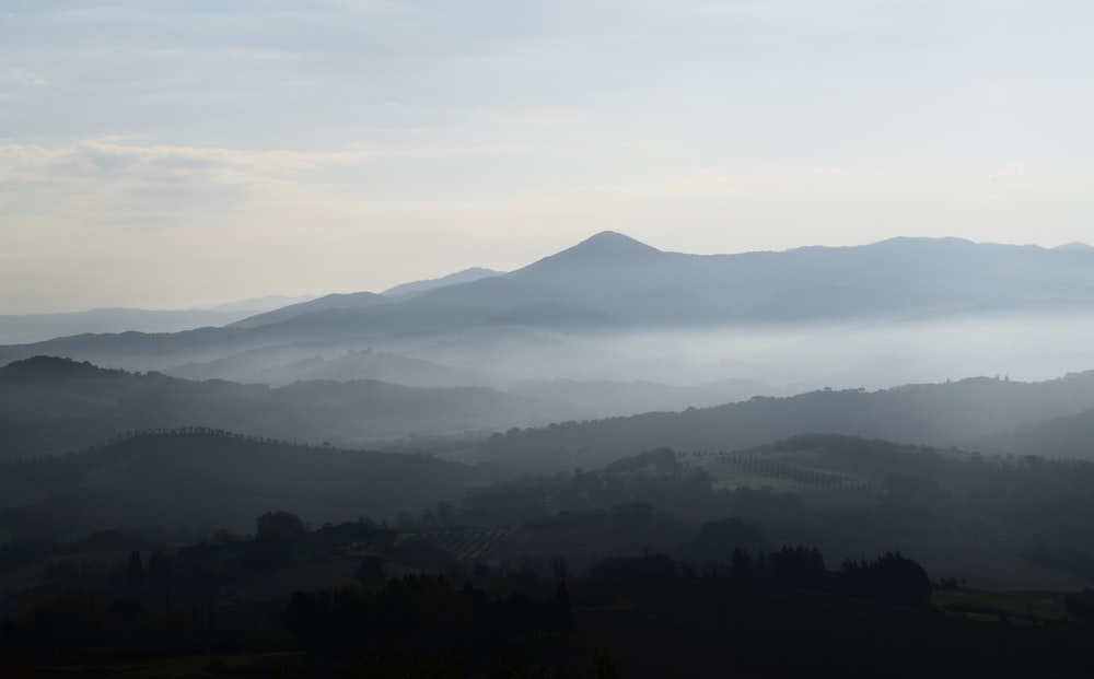 mountain under gray sky