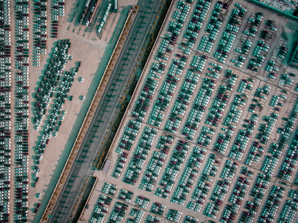 vehicle park on parking lot near gray highway aerial photography