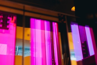 A glowing neon purple and electric blue digital cityscape with animated motion graphics reflecting a futuristic vibe.