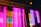Close-up of a trendy neonvibe bag glowing softly under city lights at night