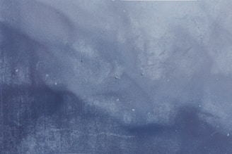 a black and white photo of a blue wall
