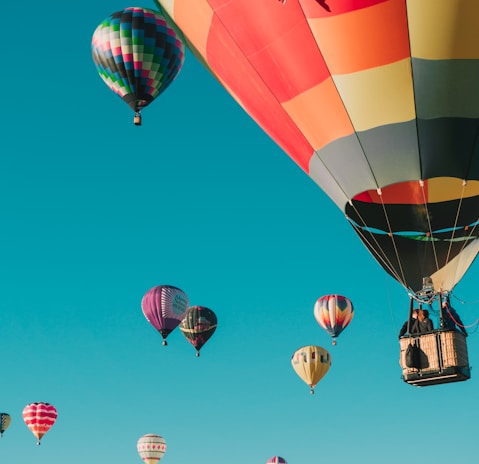 hot air balloons under blue sky