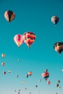 assorted hot air balloons flying at high altitude during daytime