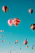 assorted hot air balloons flying at high altitude during daytime