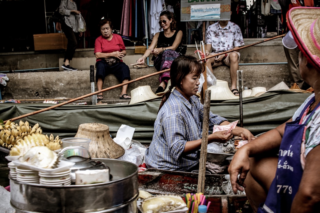 Food vendors and everyday shops at street level in a Chinese residential neighborhood, showing the density and variety of daily services within walking distance