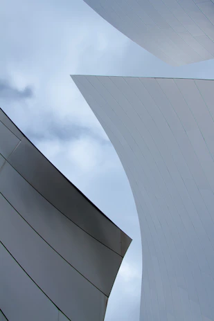 Futuristic architecture with sharp focus on metallic surfaces and cinematic shadows, illustrating scalable enterprise automation in a luxury technology environment.