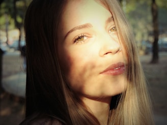 Close-up of a sun-kissed model with soft beach waves and natural makeup under Mallorca sunlight