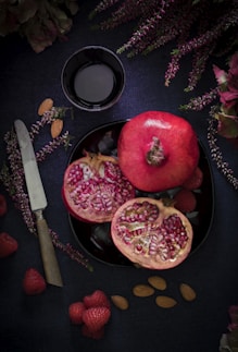 red fruit on black plate