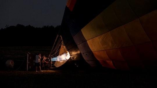 two men starting hot air balloon in Tavarnelle Val di Pesa Italy