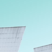 A sleek, modern portacabin set against a clear blue sky in Jeddah.