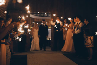 A dazzling cold fire display lighting the wedding entrance with warm sparks.