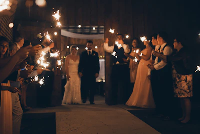A dazzling cold fire display lighting the wedding entrance with warm sparks.