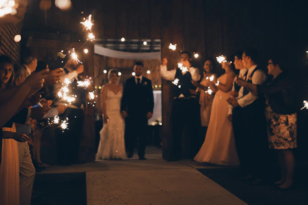 A vibrant wedding entrance glowing with fog and cold fire effects under soft lighting.