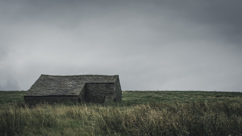 house in the middle of grass field