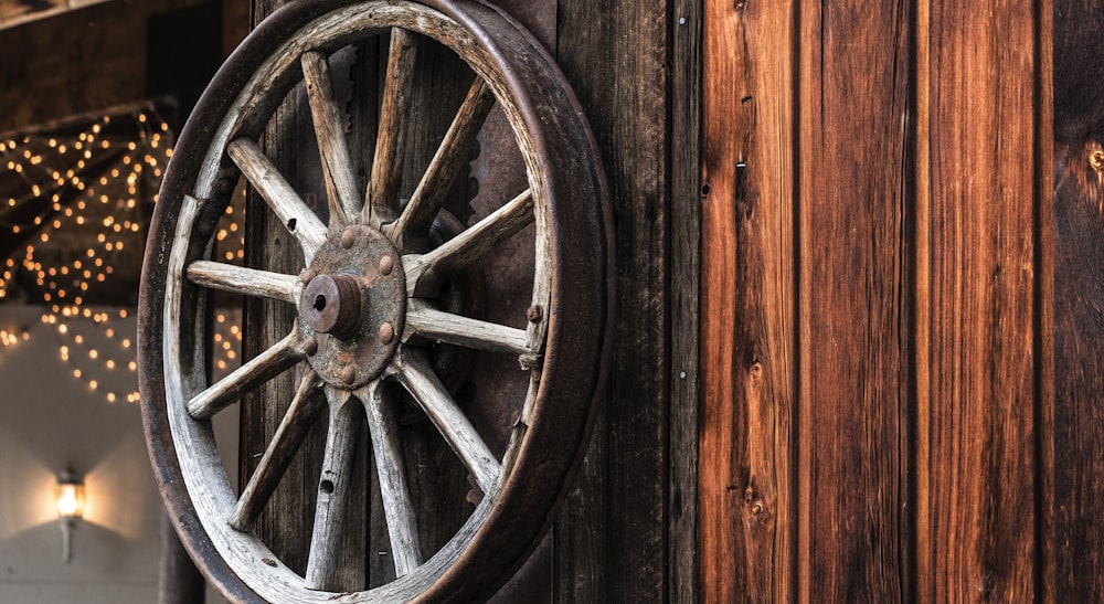 brown carousel wheel hanging on wall