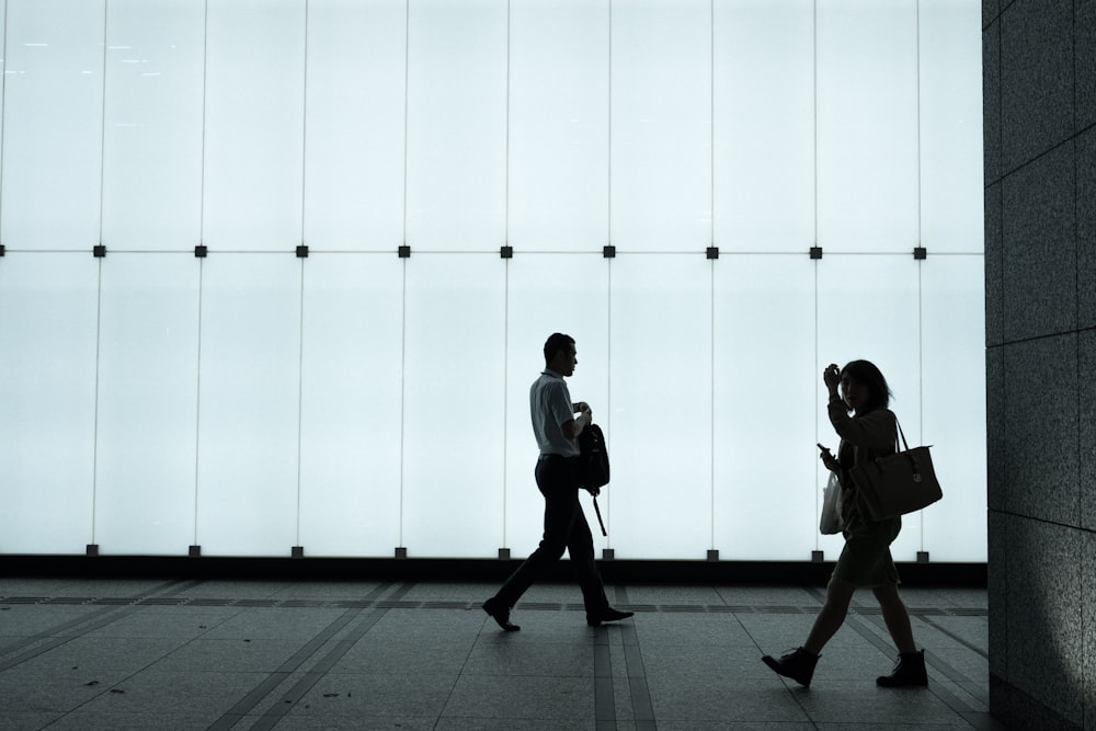 silhouette photo of two person inside room