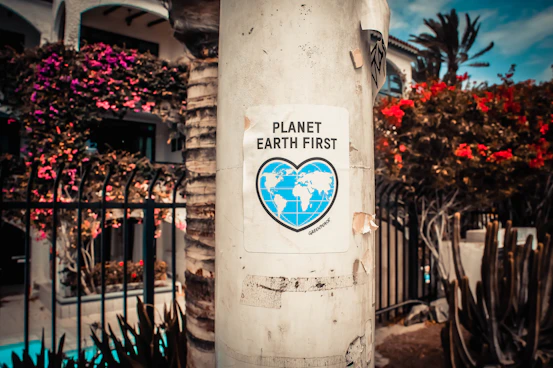 An environmental campaign sticker, illustrating the environmental impact point on this page