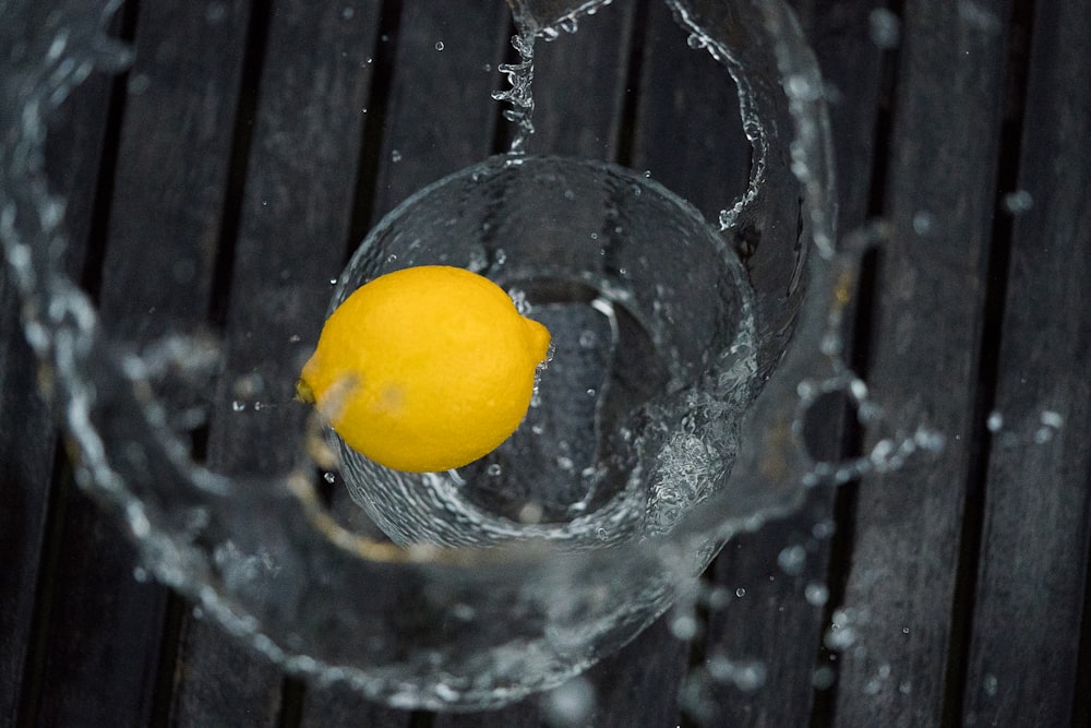 yellow lemon on drinking glass