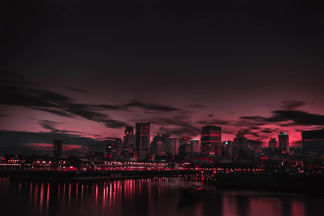 A dynamic cityscape at night bathed in black and red hues, capturing the essence of Tunisian Hoods roleplay.