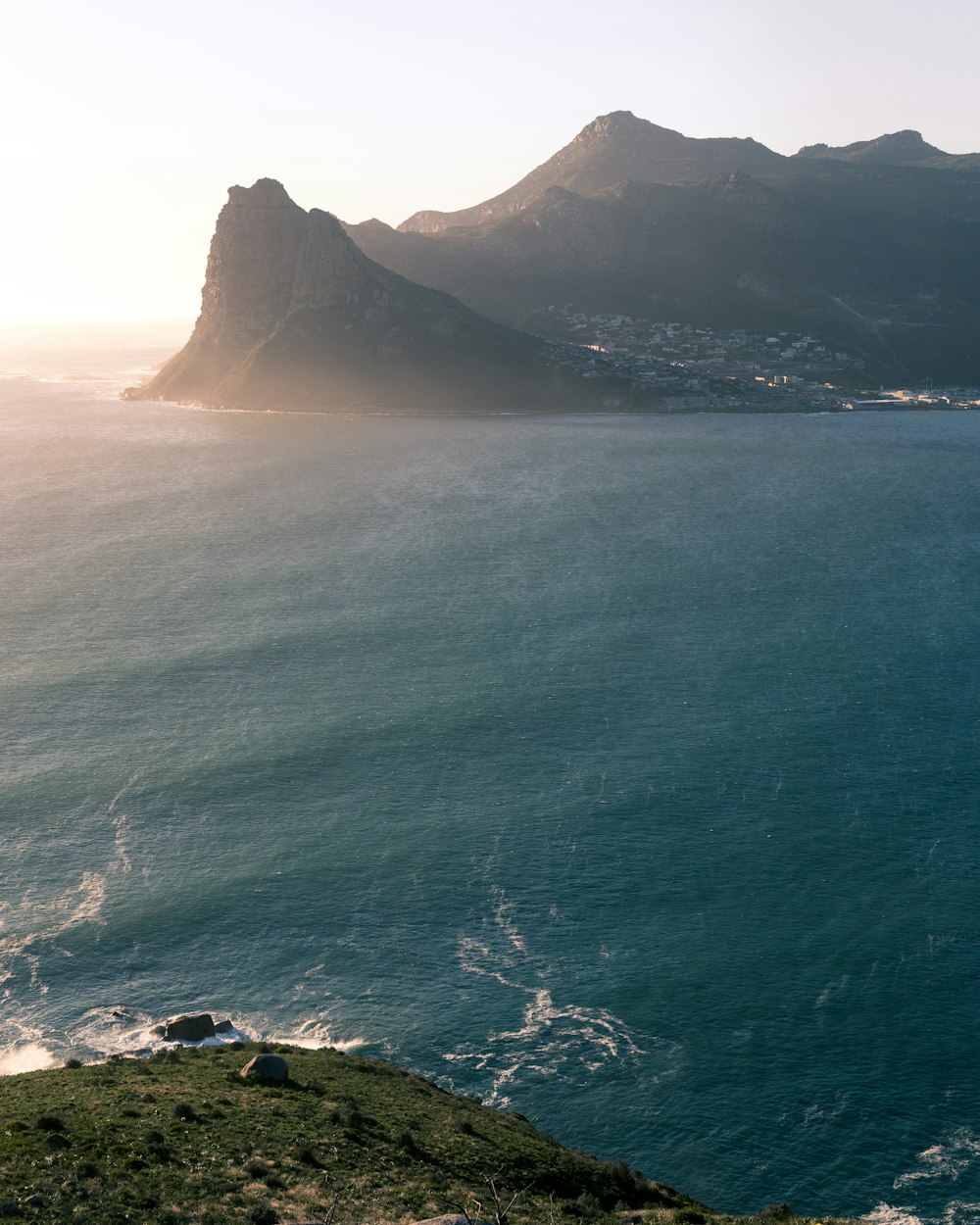 aerial view of hilltop near body of water