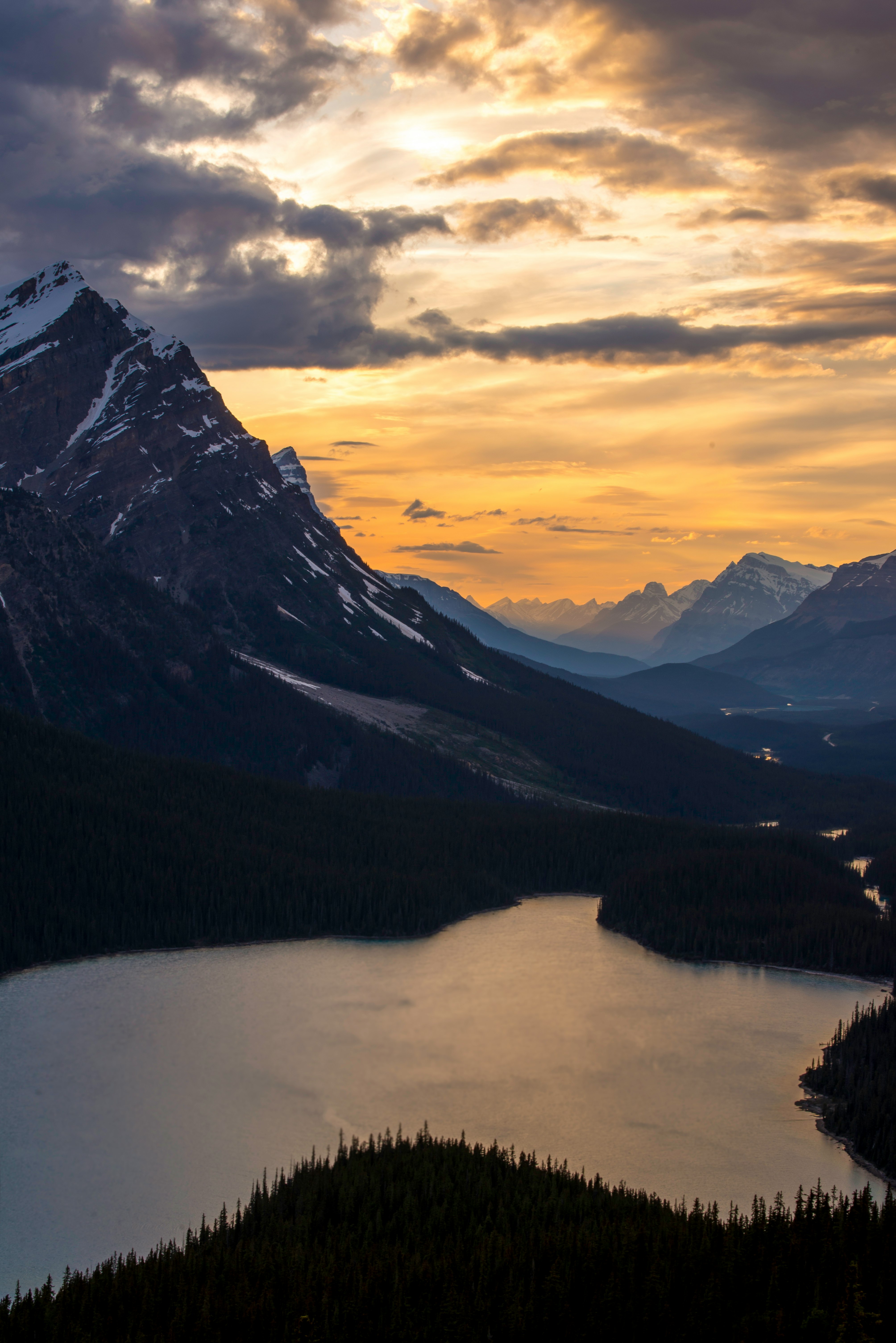 photo of lake near mountain at golden hour