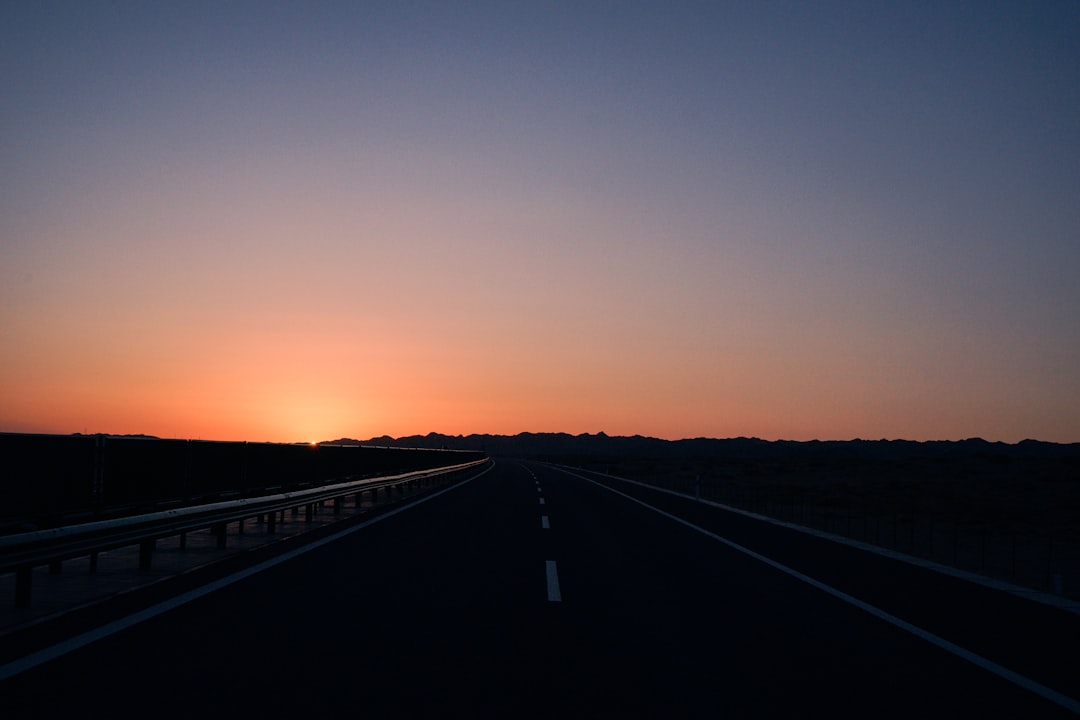 view of empty road during sunset