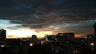 A vibrant cityscape at sunset, symbolizing destinations supported by Viamente crowdfunding.