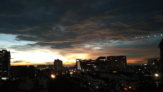 A vibrant cityscape at sunset, symbolizing destinations supported by Viamente crowdfunding.