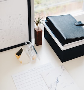 books and calendar on white table