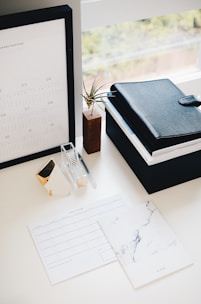 professional books and calendar on white table