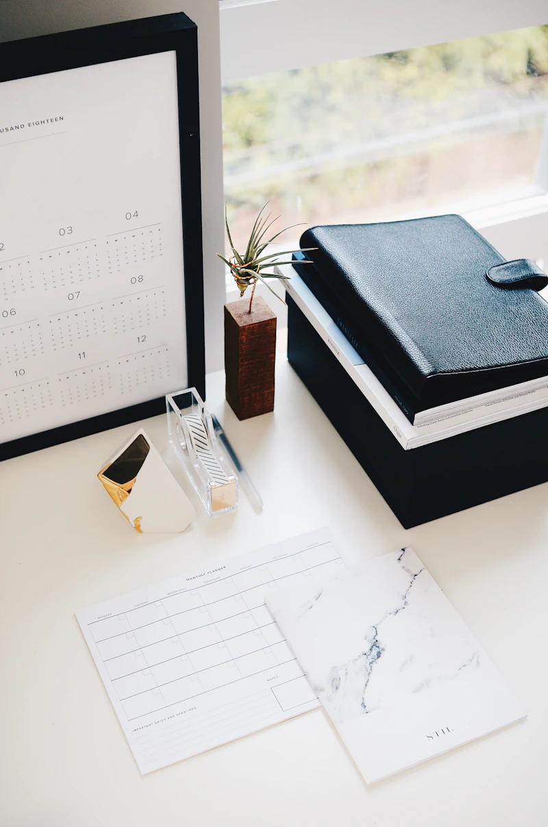 Open planner and calendar on a clean desk
