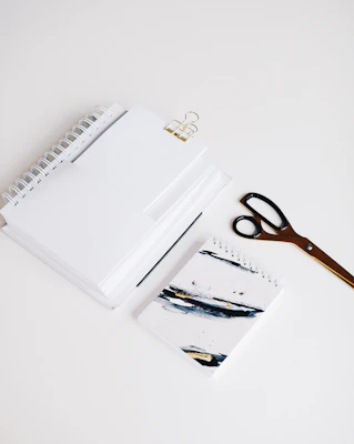 Colorful school supplies neatly arranged on a wooden desk.