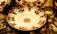 Close-up of a delicate vintage porcelain plate with floral patterns.