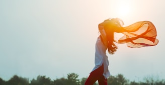 woman spreading hair at during sunset