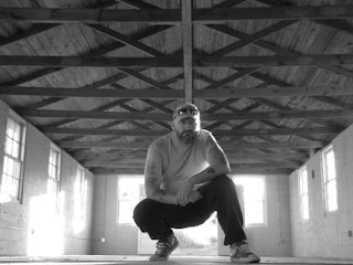 Wide shot of a clean, dry crawl space with new insulation and lighting.