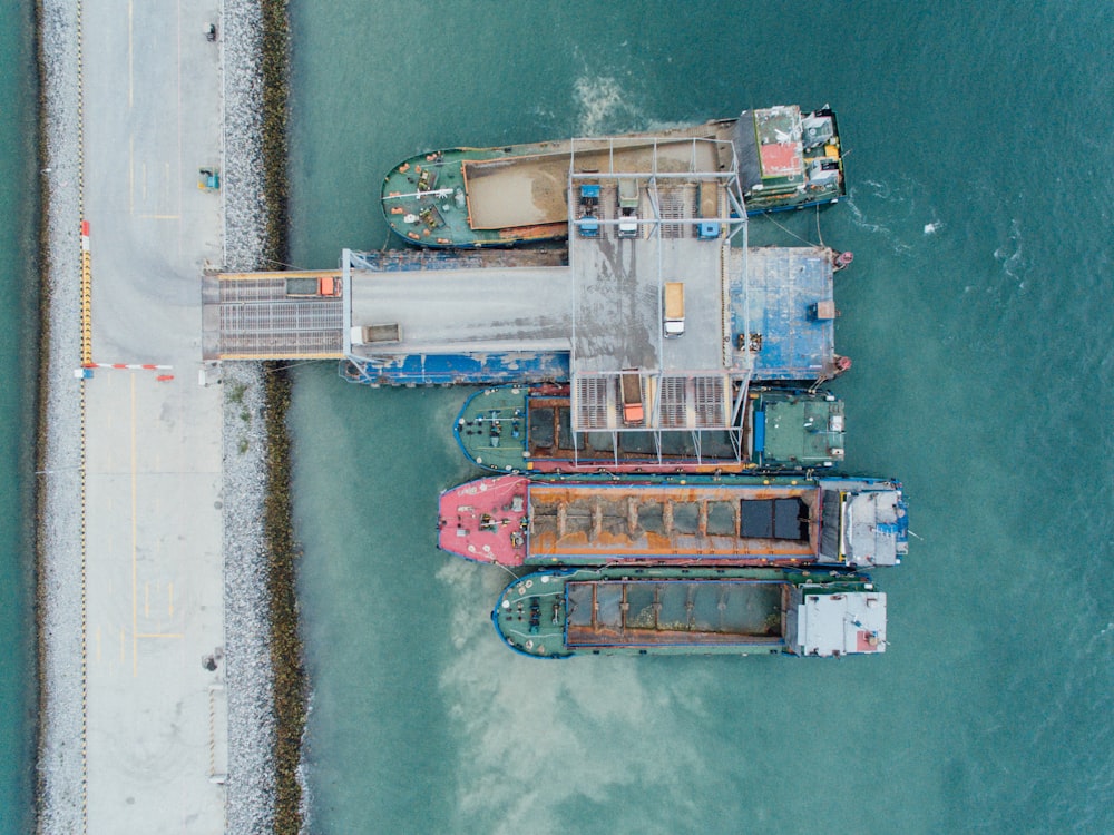 five boats on body of water