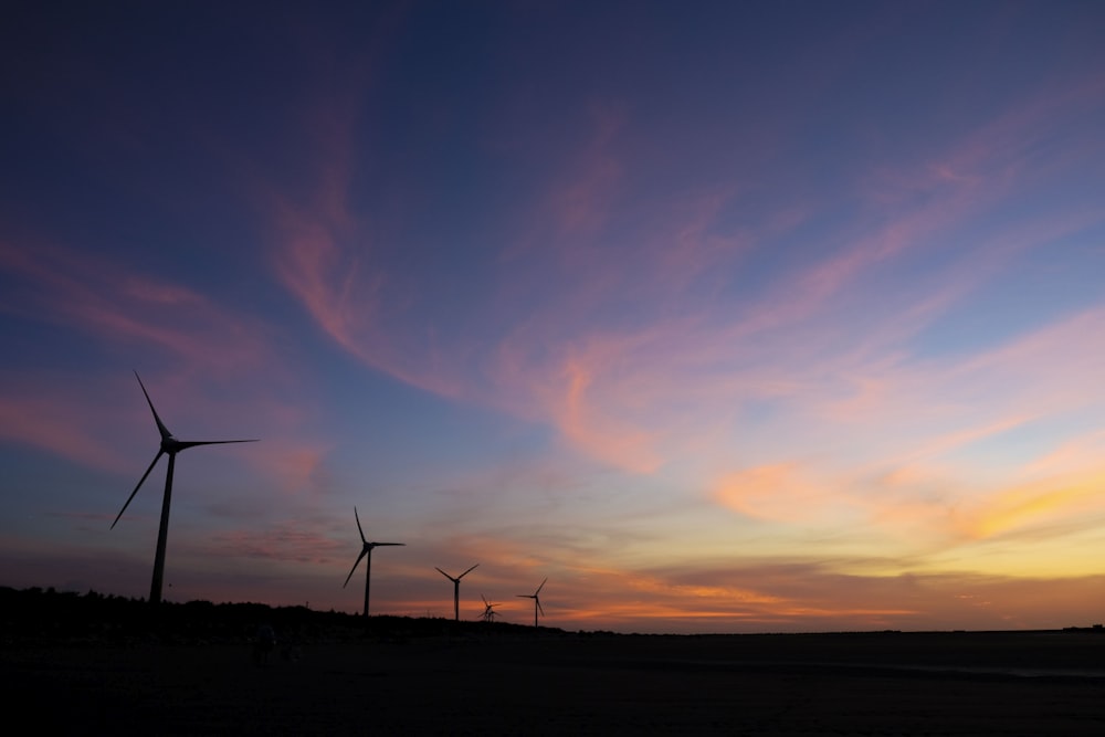 silhouette of wind turbines