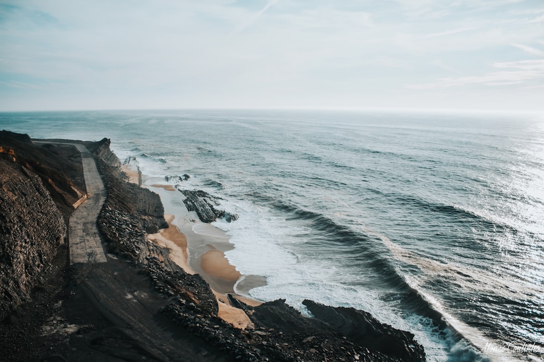 body of water near on the cliff